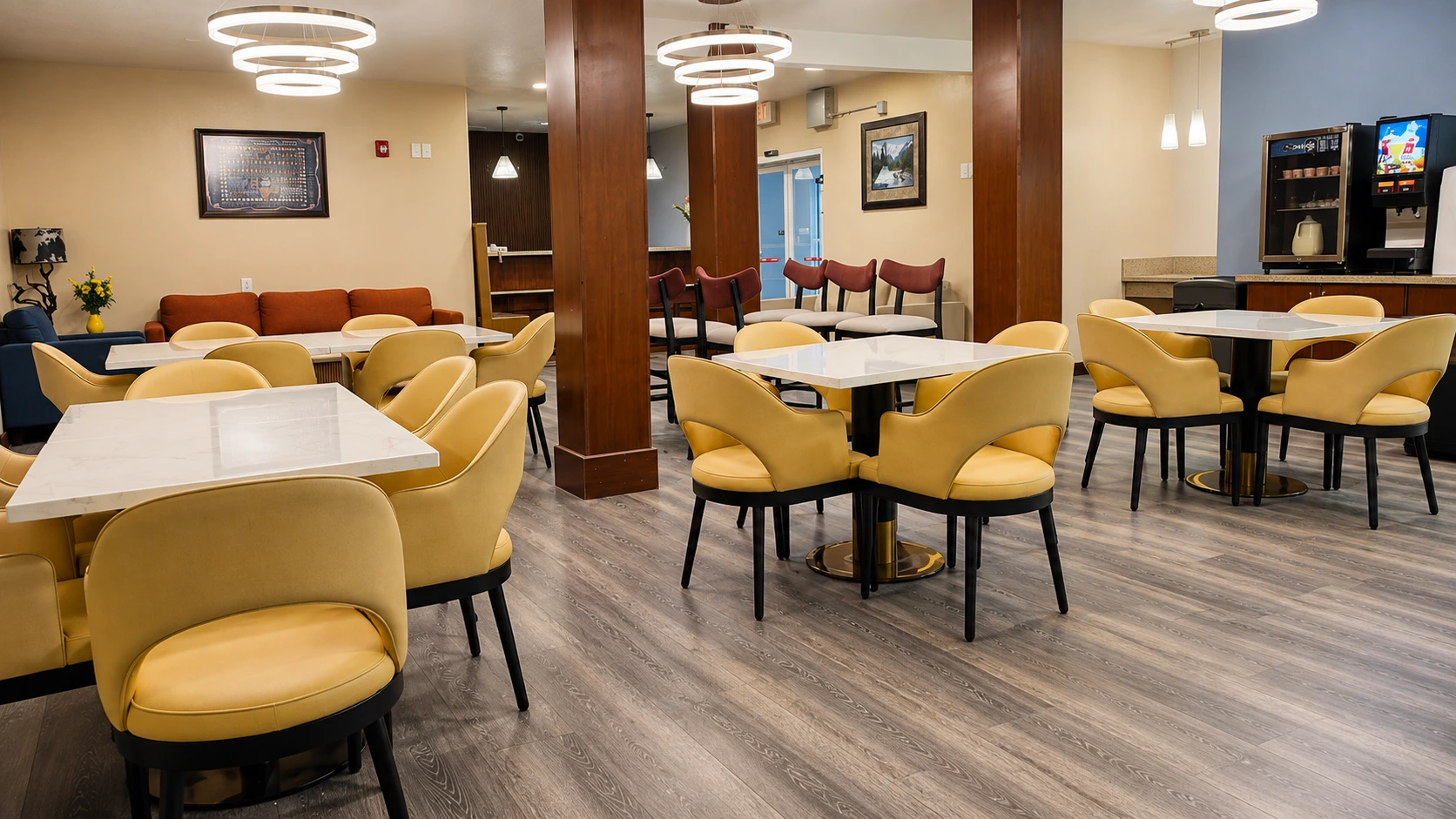 Breakfast dining room with marble-topped tables and a lounge seating area beyond — Best Western Vernal Inn, Vernal Utah
