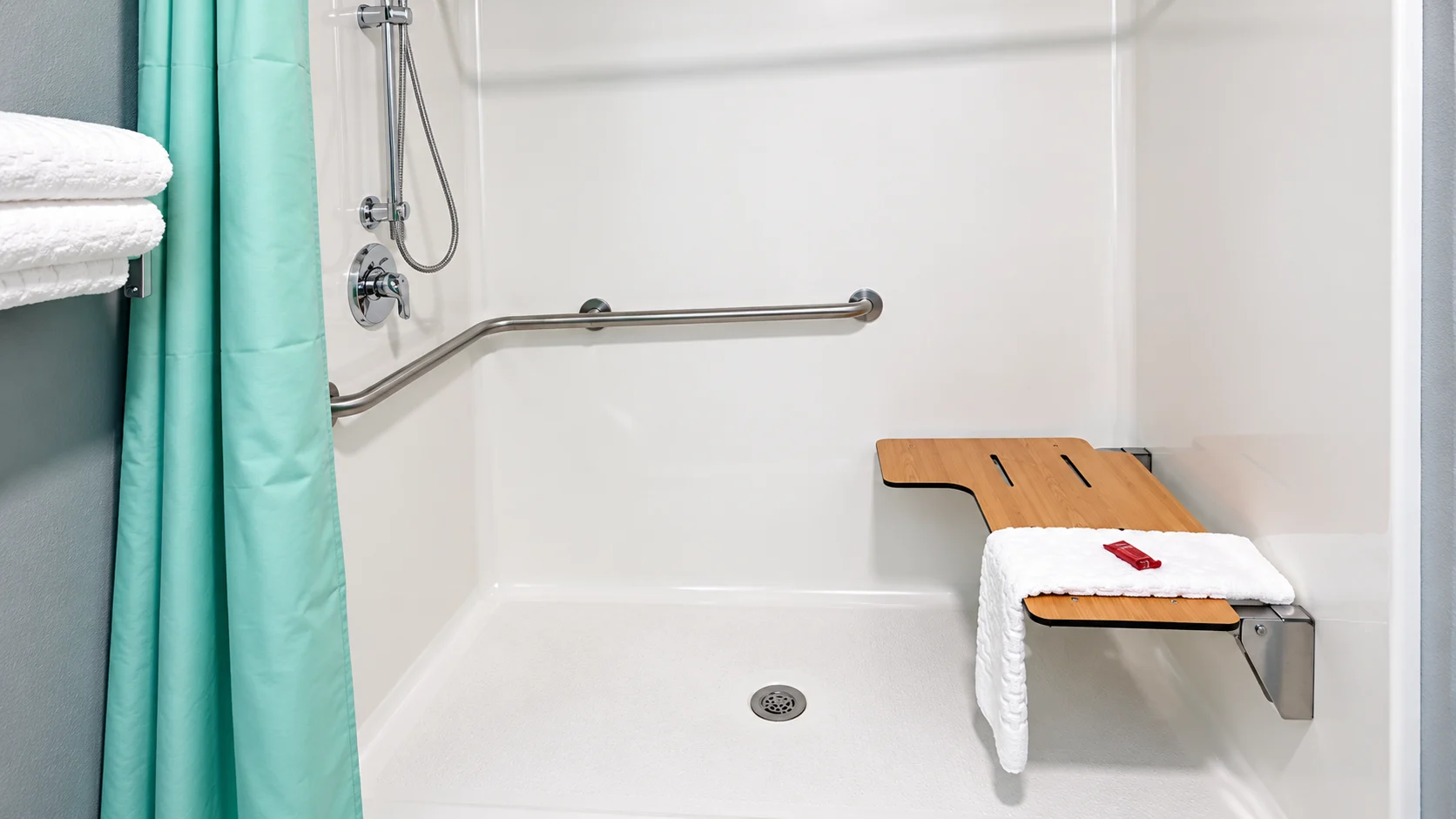 Accessible shower with handheld sprayer, slide bar and fold-down seat — Best Western Vernal Inn, Vernal Utah