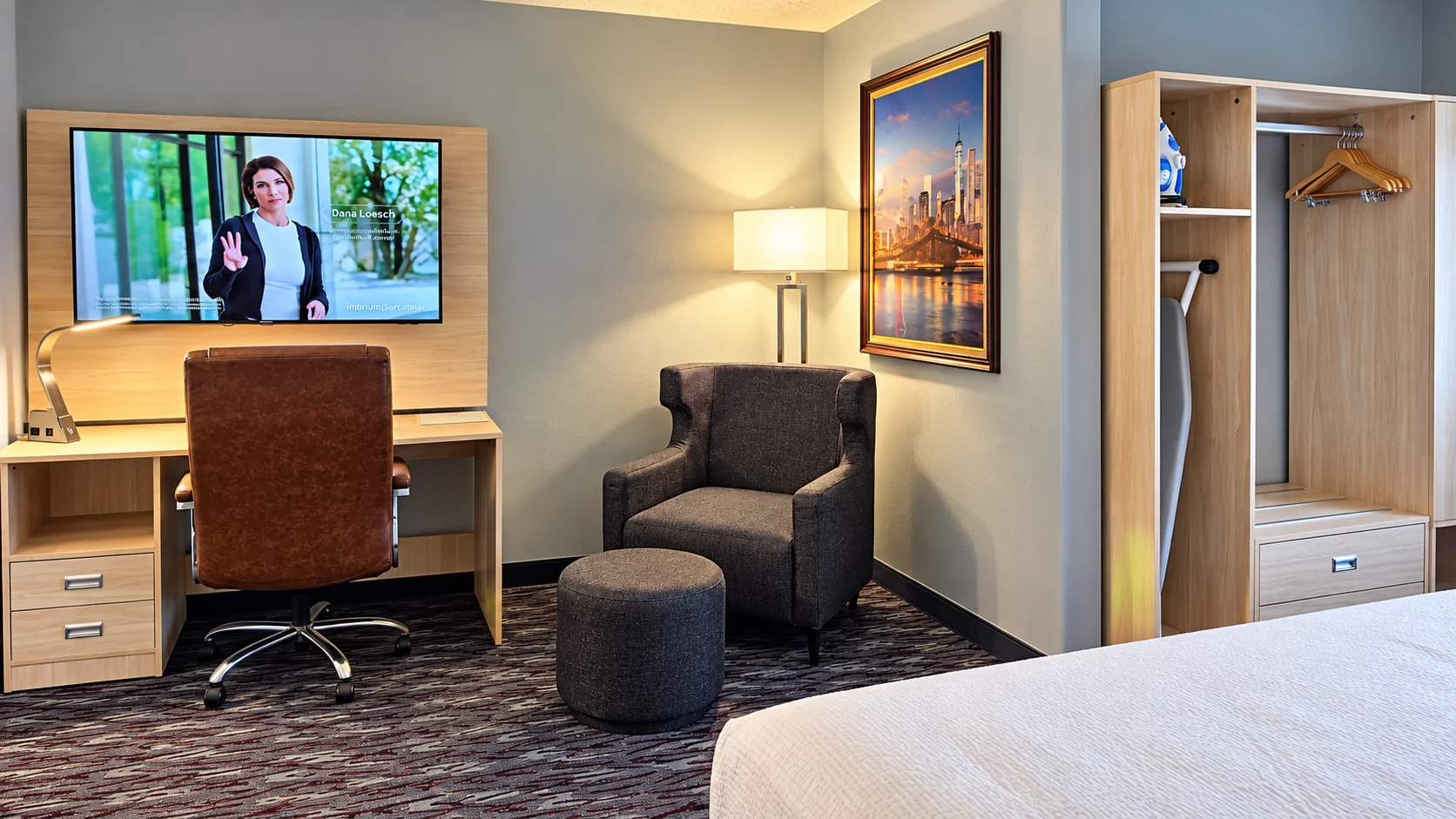 Desk, office chair, TV, armchair and open closet in a guest room — Best Western Vernal Inn, Vernal Utah
