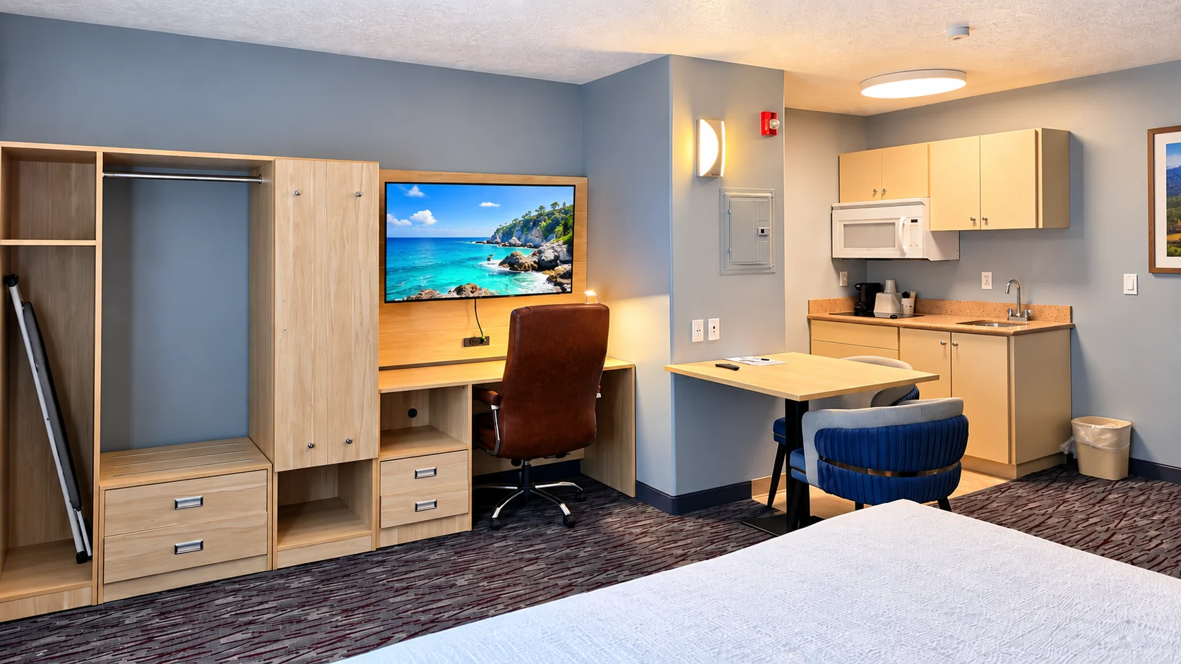 Open closet, desk, TV, dining table and kitchenette in a Studio King — Best Western Vernal Inn, Vernal Utah
