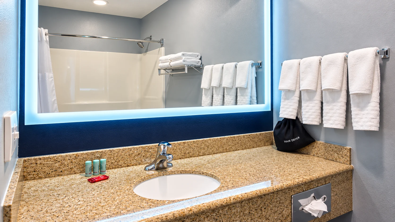 Hotel bathroom vanity with granite counter and backlit mirror — Best Western Vernal Inn, Vernal Utah