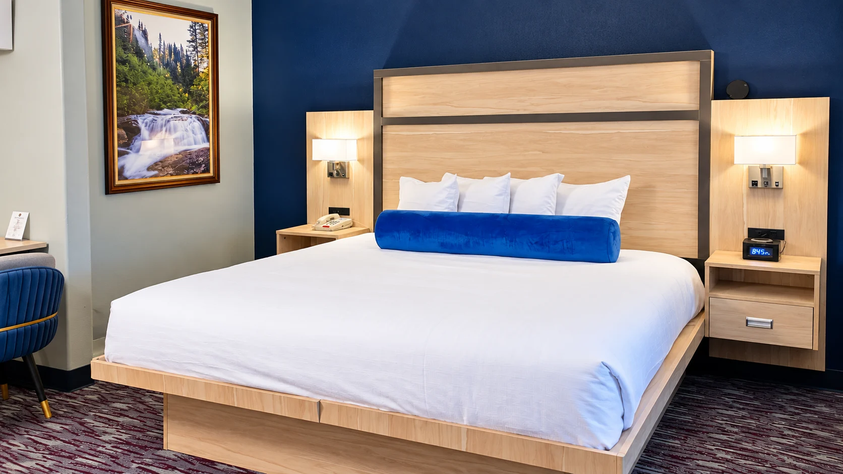 Queen bed with panelled headboard and wall reading lights — Best Western Vernal Inn, Vernal Utah